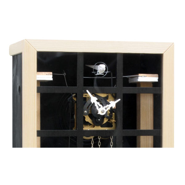 Detailed view of the EINBLICK black cuckoo clock, showing the glass panel, inner clock mechanism and cuckoo bird.