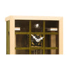 Close-up of the green EINBLICK cuckoo clock, showing the glass panel, inner clockwork movement and cuckoo bird.