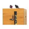Close-up of DUETT bamboo cuckoo clock showing carved wooden birds and inner clock movement.