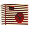 Close-up of BAUHAUS red cuckoo clock showing wooden slat design and visible cuckoo bird.