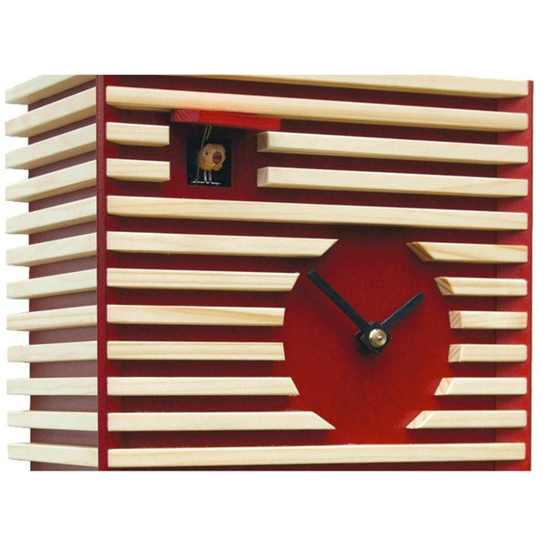 Close-up of BAUHAUS red cuckoo clock showing wooden slat design and visible cuckoo bird.