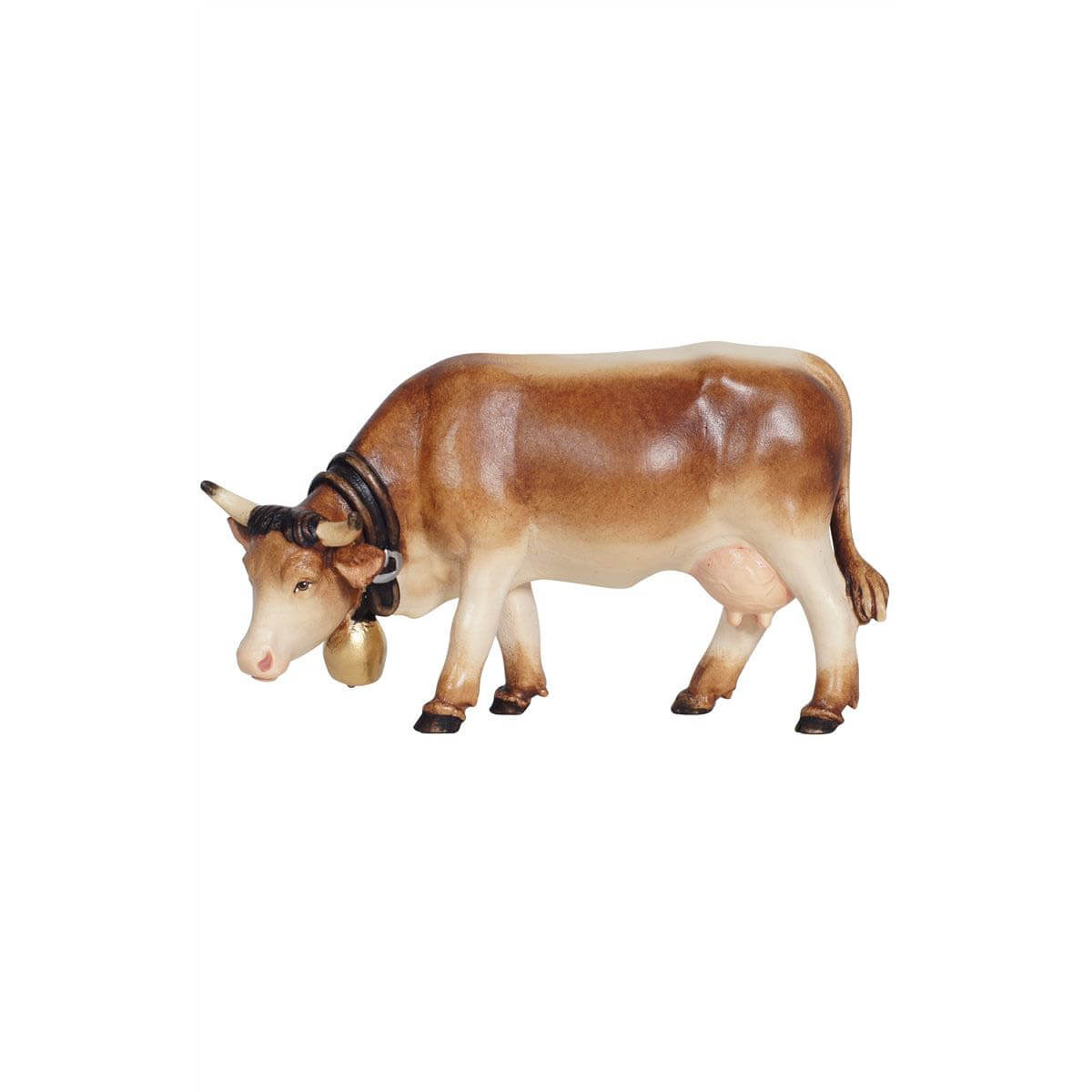 Pema Kostner Nativity light brown cow with white feet and a white face, adorned with a bell around its neck, grazing peacefully