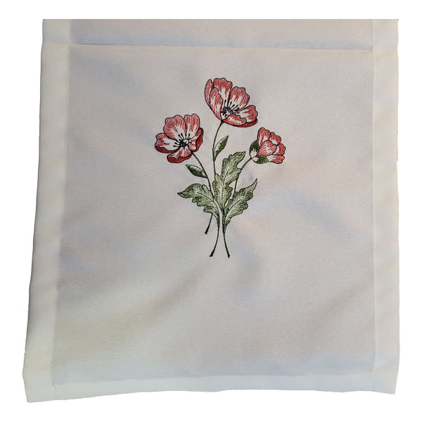 Close-up view of vibrant red poppy flowers with green stems on both ends of the Linen Table Runner.