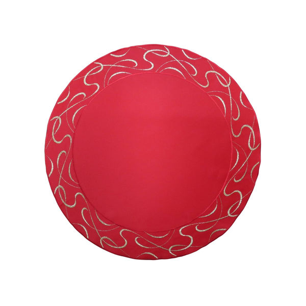 Round red table linen with decorative embroidered scroll border