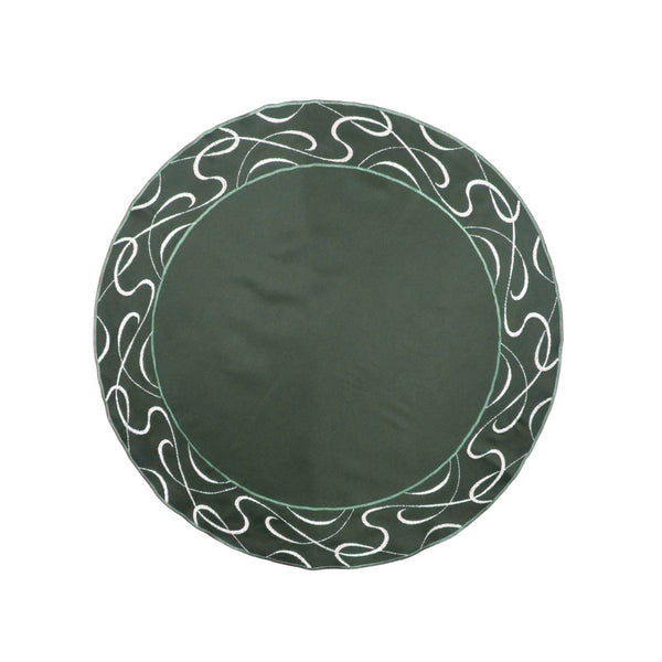 Round green table linen with embroidered scroll border and solid center design