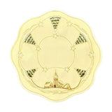 Round champagne color table linen with scalloped edges. Outer border design of snow covered church and trees, with alternating star designs in between. Interior border is a design of golden threading with stars.