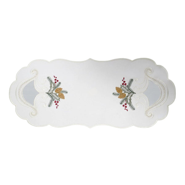 White linen table runner with embroidered candle and holly design and decorative sheer cutout details