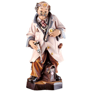 Hand-carved wooden doctor figure by DEUR with vintage tools, made in South Tyrol