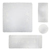 White linen table set with leaf tendril embroidery including square tablecloth, table runner, and round doily with scalloped cutwork edges