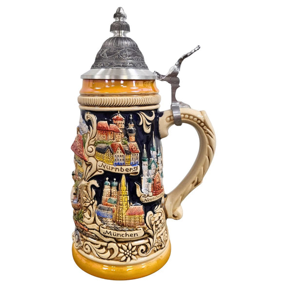 side of German beer stein with Bavarian couple in traditional clothes, farmhouse, bouquet, famous city landmarks (Nuernberg, Muenchen, Neuschwanstein), and pewter lid. Bottom banner reads "Bayern."