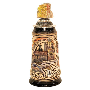 0.25L German beer stein with Berlin landmarks GEdaechtniskirche, Brandenburger Tor in relief, and pewter lid featuring a real Berlin Wall fragment.