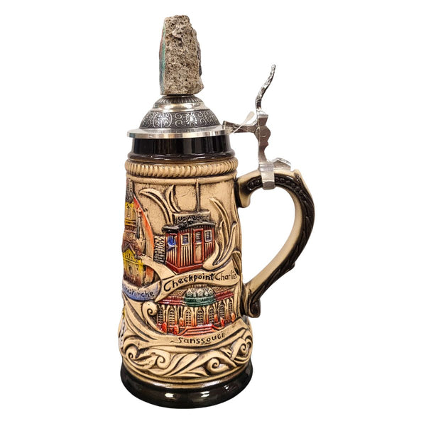 side of 0.25L German beer stein with Berlin landmarks Checkpoint Charly, Sanssouci in relief, and pewter lid featuring a real Berlin Wall fragment.