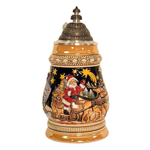German beer stein with Santa sleigh scene, reindeer, snowy village, Christmas banner, starry sky, and domed engraved pewter lid.