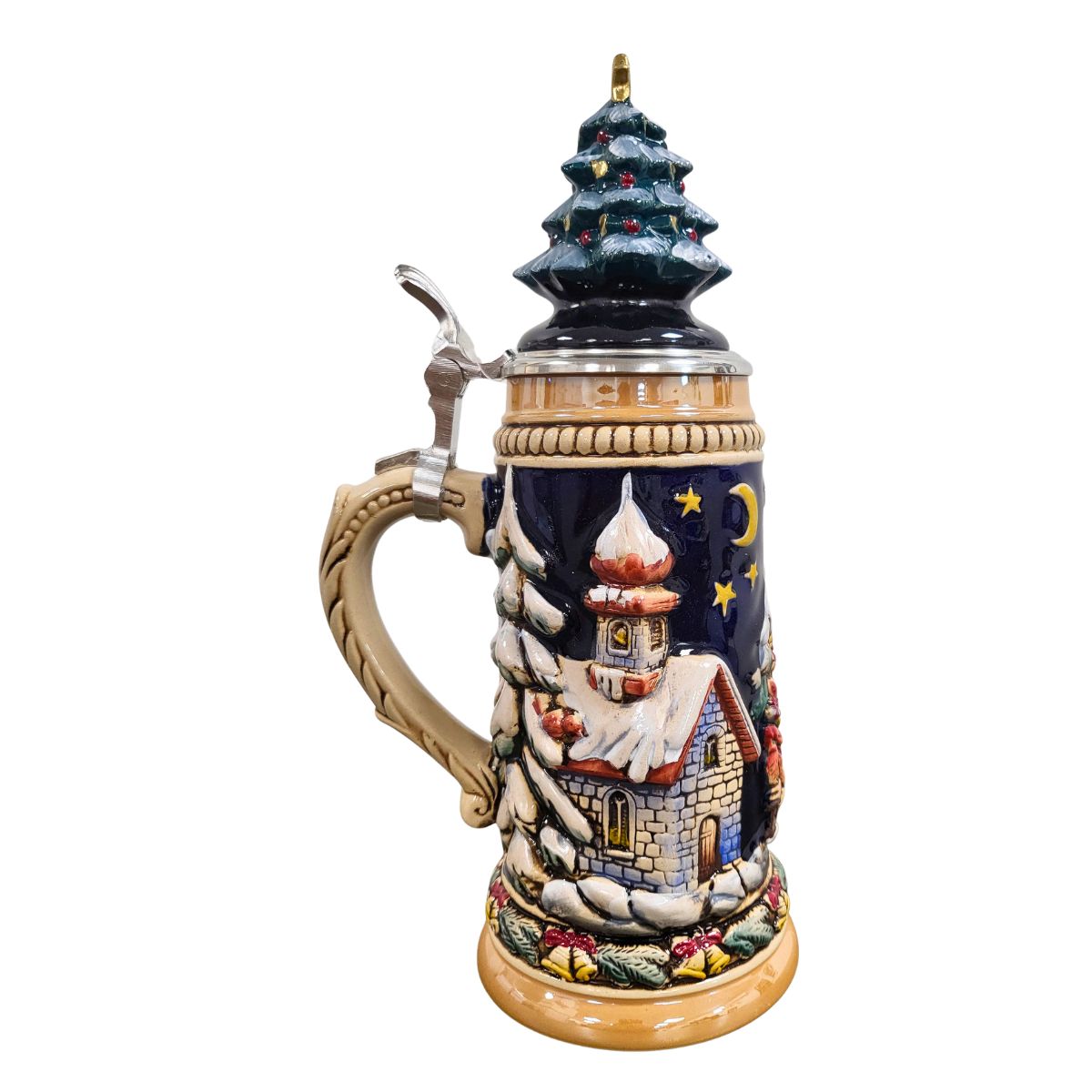 side of German beer stein with Santa sleigh scene, reindeer, snowy forest,snow covered church, and ceramic Christmas tree lid topped with a golden star.