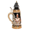 side of German beer stein with Santa sleigh scene, reindeer, snowy forest,snow covered church, and ceramic Christmas tree lid topped with a golden star.

