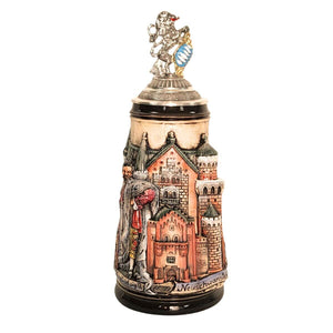The front of the stein shows the relief of the Neuschwanstein castle and is topped with an ornate pewter lid crowned by a finely detailed Bavarian lion holding a white and blue shield, symbolizing the Bavarian flag.