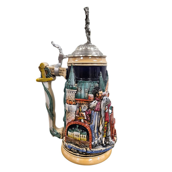 The side shows the Linderhof as well es King Ludwig II holding a sword.  The handle is sculpted in the shape of a sword.