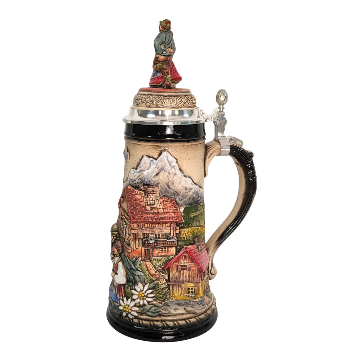 1-liter German beer stein with alpine couple, edelweiss flowers, mountain chalet, and pewter lid with dancing Bavarian figurines.

