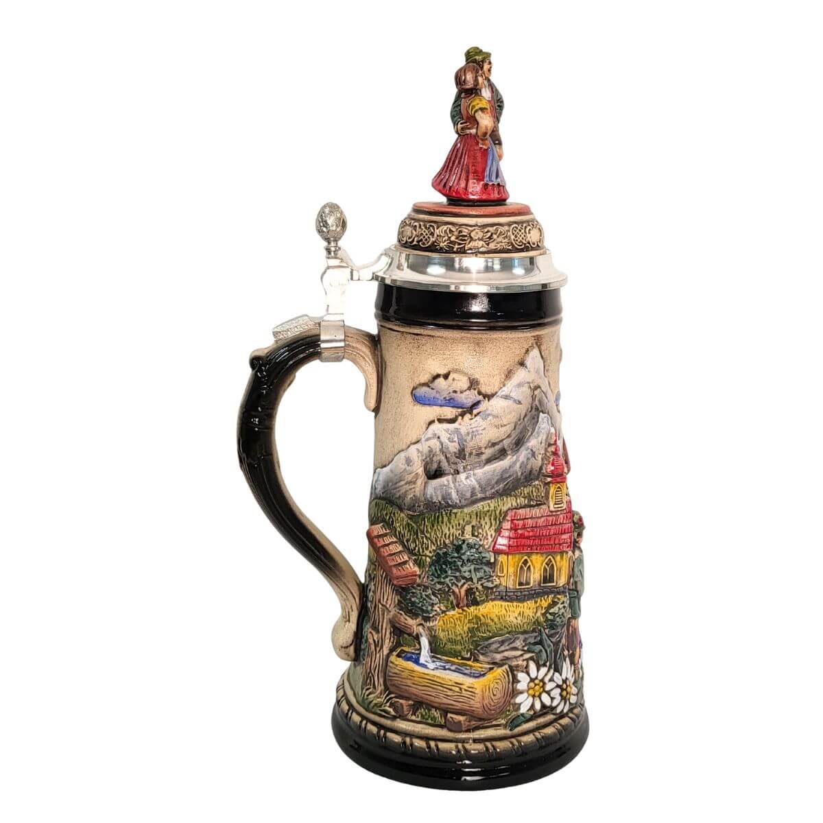 side of 1-liter German beer stein with alpine couple, edelweiss flowers, chapel, and pewter lid with dancing Bavarian figurines.

