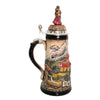 side of 1-liter German beer stein with alpine couple, edelweiss flowers, chapel, and pewter lid with dancing Bavarian figurines.

