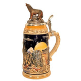 side of Wolf-themed German beer stein close-up of a calm wolf with eyes closed, posed in front of a glowing full moon, and pewter lid topped with a hand-painted wolf figurine.
