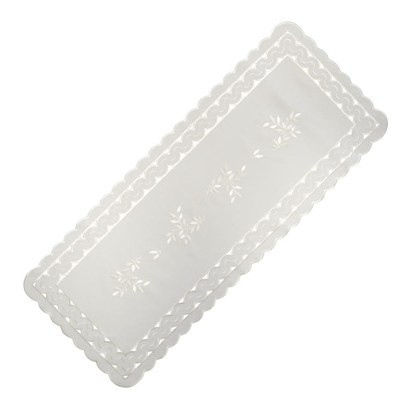 White linen table runner with scalloped cutwork edges and subtle leaf tendril embroidery, large size