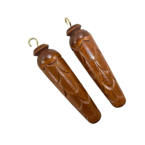 Pair of decorative wooden pinecone weights for quartz cuckoo clocks with carved Black Forest detailing.