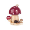 Hand carved smoker house built in the shape of a large toadstool mushroom. This incense burner releases the smoke through the little white chimney on the red cap with white dots. Next to it is a smaller mushroom, a snail with its little house and a pinecone. 