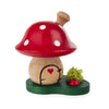 The hand-made wooden toadstool mushroom has a natural stem and a red cap with white dots. There is a little door with a heart painted on the stem. A little ladybug for additional good luck sits on the green base decorated with a green piece of grass. The toadstool can be lifted off the base to put the incense cone on a small round plate. After putting the toadstool back onto the base, the smoke will come out the little chimney on the mushroom cap.