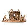 Sculpted wooden Artis Nativity set. Includes display base with stable, and figurines of the Holy Family, Angel, the Three Kings, a Shepherd, an ox, a donkey, and three sheep.