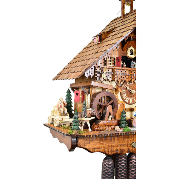 Left side view of the Schwer 8 Day clock, featuring it's moving water wheel