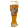 Wheat beer glass with the crest of a German eagle in the center, bordered by boughs of berries and German flags.