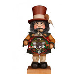This Christian Ulbricht Smoker is traditionally dressed like a man from the Black Forest. To emphasize this, he holds a cuckoo clock. He is protected from wind and weather in his felt coat.