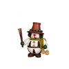 Christian Ulbricht snowman smoker with a flower pot as a hat. His belly is decorated with fir trees and his ears he hides under ear muffs. In one hand he holds a broom, in the other pine cones. 
