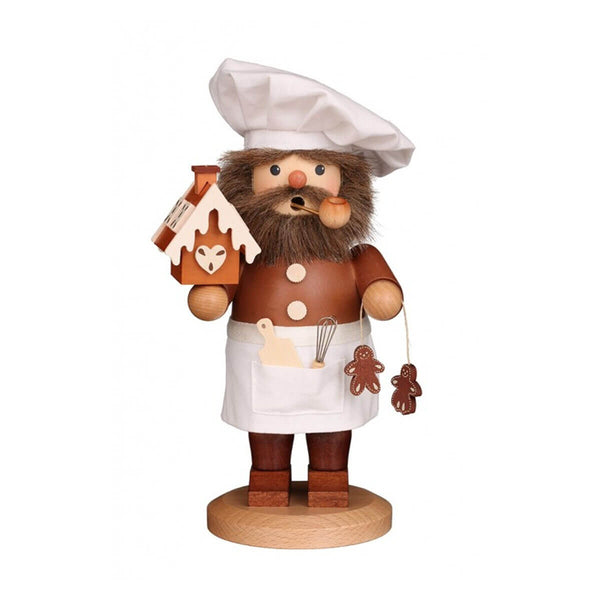 Handcrafted Christian Ulbricht smoker featuring a confectioner in a white chef's hat and apron, holding a gingerbread house and cookies, with a natural wood finish.