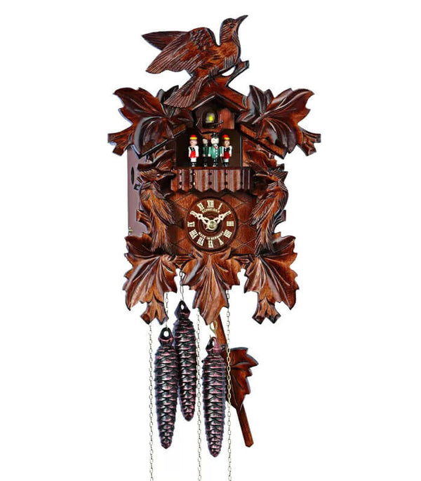 1-Day Schneider Traditional Black Forest Coocoo clock with music and dancers. There are two intricately carved birds on each side of the clock box and a third bird is sitting on top of the roof. Three-dimensional maple leaves decorate the four corners of the clock and there is a fifth leaf underneath the dial. Above the dial, there is a balcony with dancers and above them, the cuckoo bird comes out behind its door. 