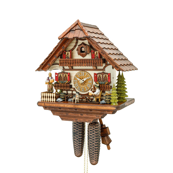 Handmade 8-day Black Forest mechanical cuckoo clock by Hekas featuring a beer drinker and a waitress in a  chalet-style design.
