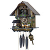1-Day Schneider Coo Coo Clock with music and dancers. Four Bavarian men are sitting at a table drinking beer. There is a waterwheel under a roof on the left. An evergreen tree sits on the right front corner. The entire clock is made out of dark stained wood. The dancers are spinning with the music above the balcony. The cuckoo comes out behind his door above the dancing figurines at the top. The roof is smooth without shingles. 