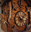 The Dial of a Schneider Black Forest Cuckoo Clock with roman numerals framed with Ivy Vines 