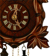 Close up of a  detailed Grape Leaf next to the Dial on a Schneider Traditional Black Forest Cuckoo Clock