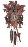 1-Day Schneider Traditional Black Forest Coocoo clock without music. The face of the brown clock is crosshatched. Two squirrels holding an acorn are sitting on each of the lower corner of the clock box. Above the squirrel are medium-sized leaves on each side and larger leaves on the two top corners and in the middle at the bottom. The cuckoo door above the dial opens when the cuckoo bird calls. There is a larger ornately carved cuckoo bird sitting on top of the crown on the roof.