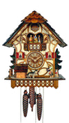 1-Day Schneider Chalet Coocoo clock, half timbered, with music. A girl is playing ball with a German shepherd. There is an evergreen tree, a fence and a doghouse to the left and a cat watching around the right corner of the house, decorated with a second green fir tree. The dial in the middle is flanked by two windows with red shutters and flower boxes. The dancers dance on the balcony above. The cuckoo bird comes out behind his door above the dancers underneath the roof made out of wooden shingles.