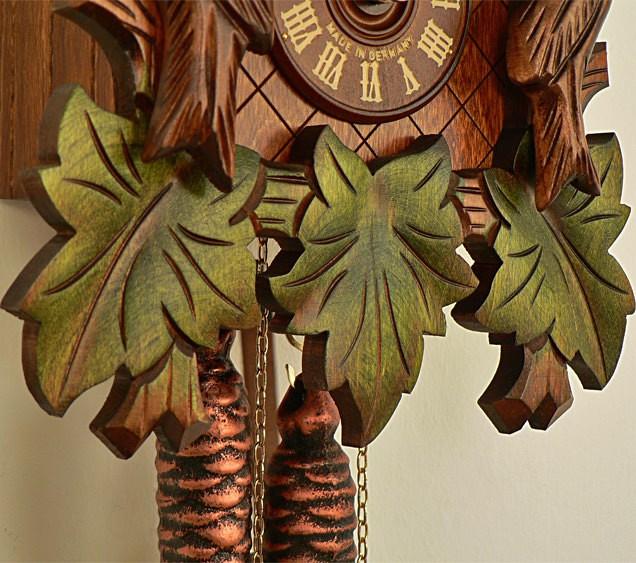 Three Green Leaves, Weights and the  Clock Face with Made in Germany on a Schneider Cuckoo Clock