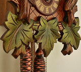 Three Green Leaves, Weights and the  Clock Face with Made in Germany on a Schneider Cuckoo Clock