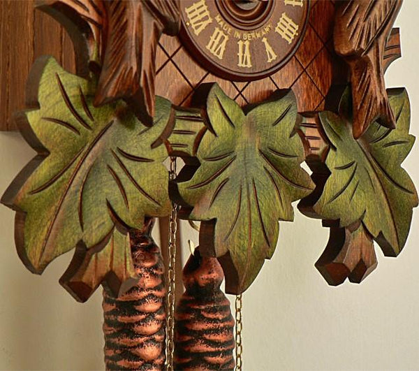 Three Green Leaves, Weights and the  Clock Face with Made in Germany on a Schneider Cuckoo Clock