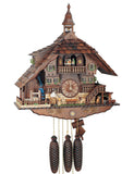 8-Day Schneider Chalet Coocoo clock with music. The dark wood chalet’s lower section looks like made of lighter stone. There is a sawmill on the left corner with a water wheel and a wood chopper. A bench sits right underneath the dial. On the right, there is a St. Bernard dog, stairs leading up to the upper floor, a small deer and a water trough. Dancers spin on the upper balcony and a bell tower sits on top of the shingled roof .