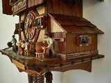 The Side of an Anton Schneider Cuckoo Clock with a Typical Brauhaus Scene Including Tapping a Keg