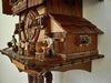 The Side of an Anton Schneider Cuckoo Clock with a Typical Brauhaus Scene Including Tapping a Keg