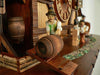 Bavarian Man in green Jacket rolling a Keg into the Brauhaus on a Schneider Black Forest Cuckoo Clock