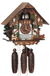 8-Day Schneider Chalet Coocoo clock with music. The white chalet features dark wood timbers and dark wood upper section. The base looks like it is made out of stone. On the right there is a water trough and a man chopping wood. On the left, a man is sitting at a table enjoying a beer while his dog is watching the wood chopper. The dancers are spinning on the balcony, flanked by dark green window shutters. 